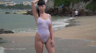 Naughty Russian MILF in White see thru swimsuit outdoors in public resort - sunporno.com - Russia