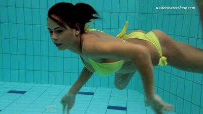 Sporty and tight brunette teenie underwater undressing - sunporno.com