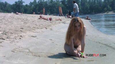 Playful blond nudist teen caught on camera naked at the beach - sunporno.com