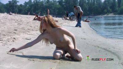 Playful blond nudist teen caught on camera naked at the beach - sunporno.com